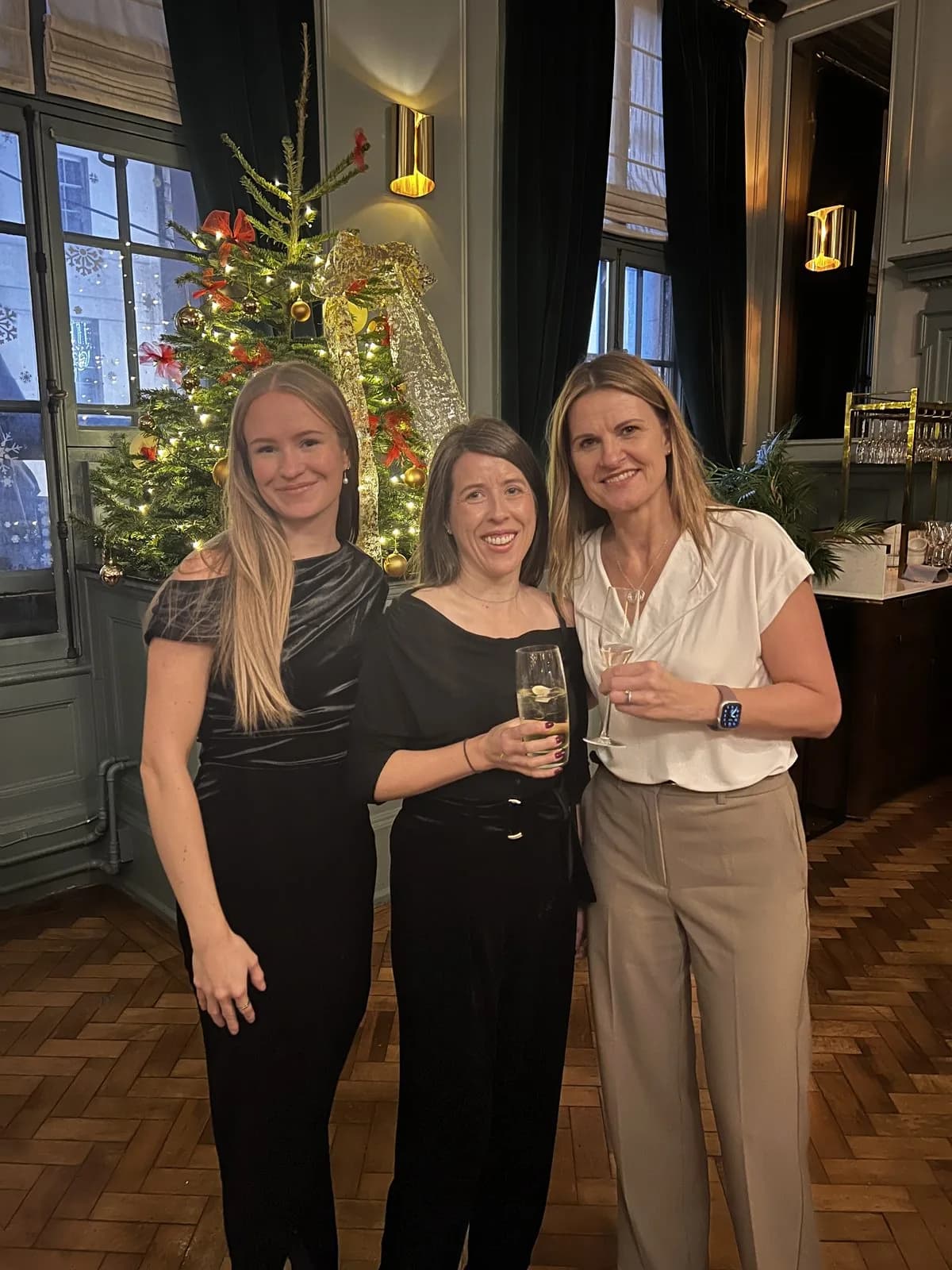 Abbie McDonnell of Glide with Dawn of Aireside Accounting and Roma of Square 4 Partners at a Christmas event