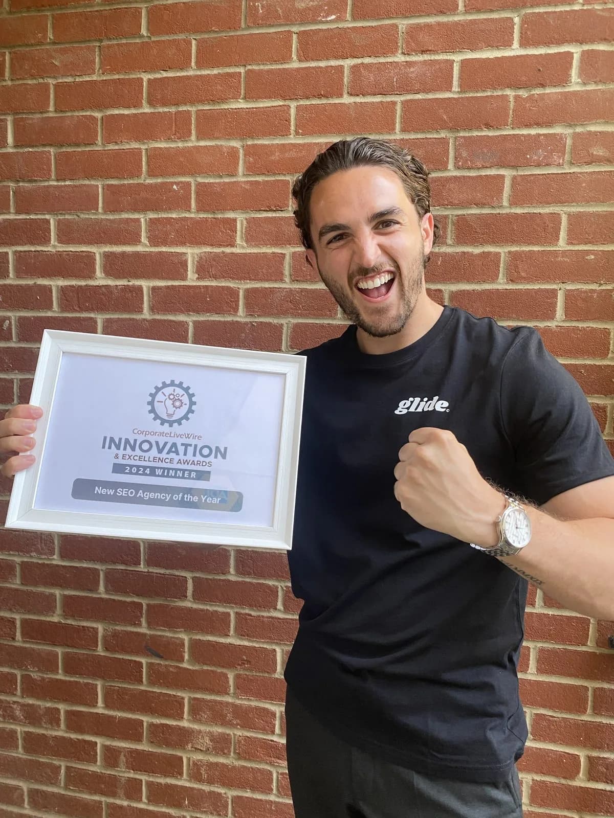 Mike McDonnell holding the Corporate LiveWire 2024 New SEO Agency of the Year certificate